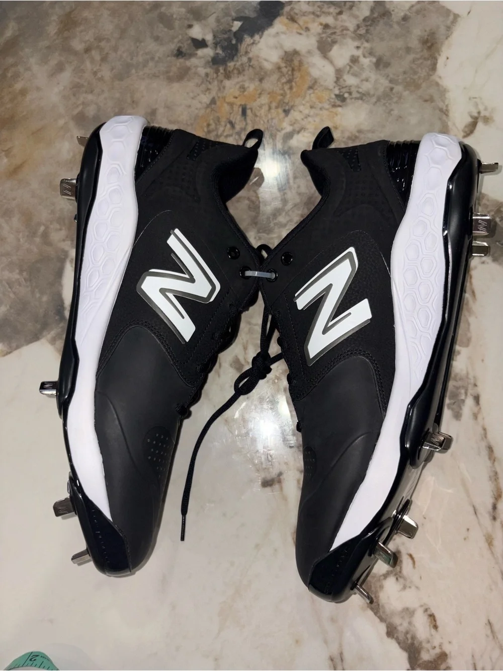 New Balance Men’s Black and White Baseball Cleats with Metal Spikes